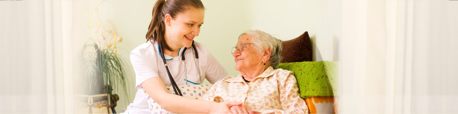 caregiver and patient smiling at each other